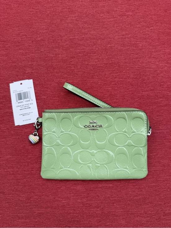 Coach Handbags - Coach NWT Embossed Signature Wristlet in Light Green $110 Gold Rainbow Key Tag